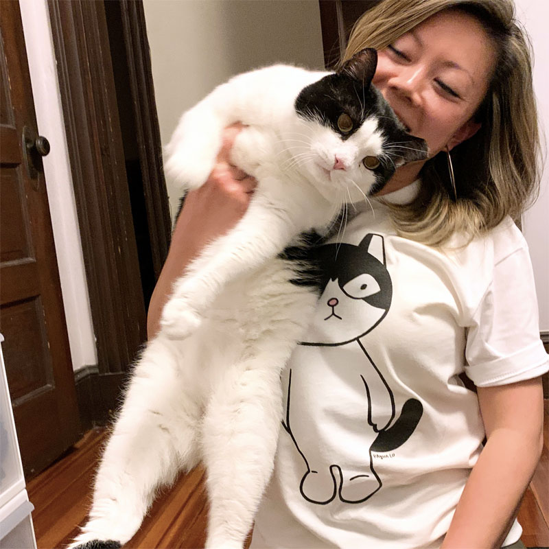 Me in my Stickermule custom T-shirt with my chonky cat Ollie
